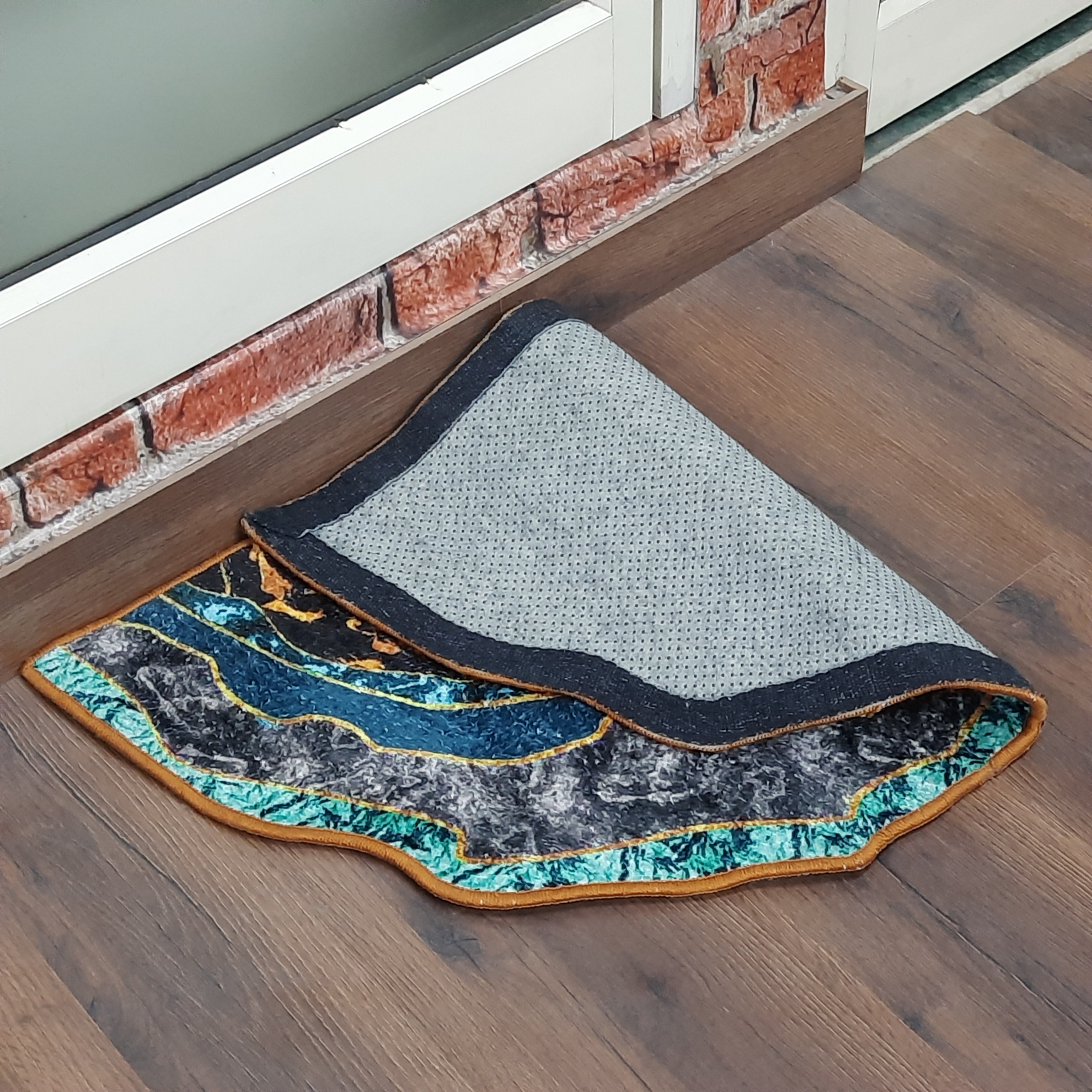 Vibrant geometric door mat perfect for indoor entrances.