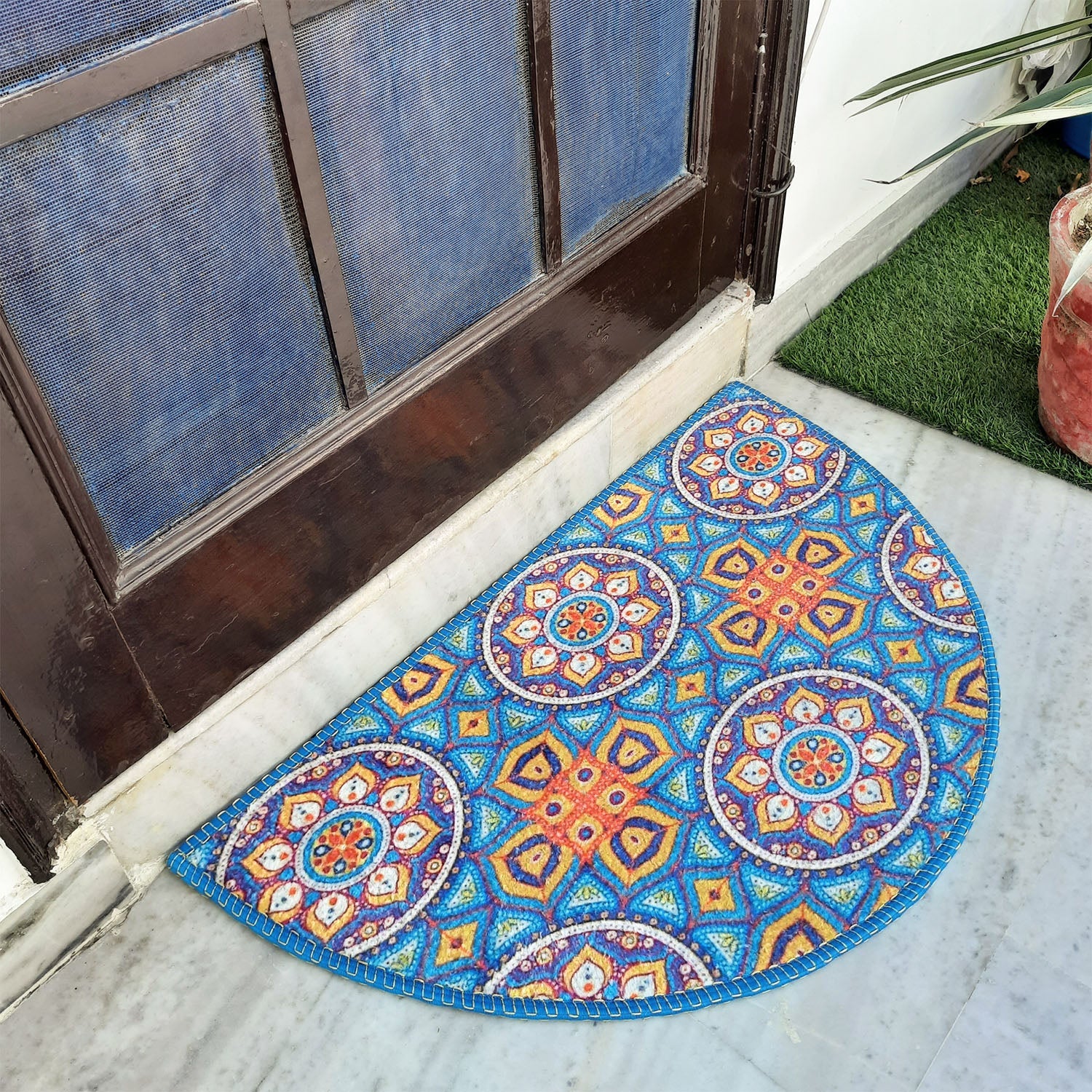 Bright geometric half-circle rug for stylish entryway décor.