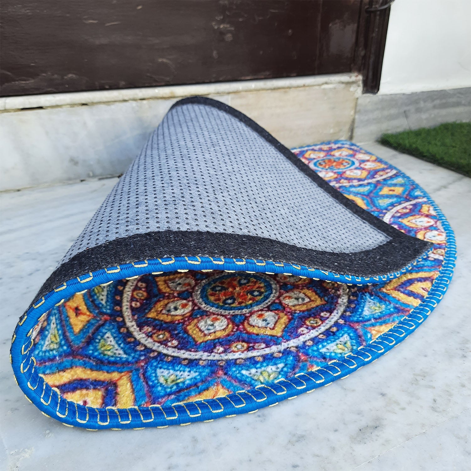 Colorful decorative mat adding personality to the front entrance.