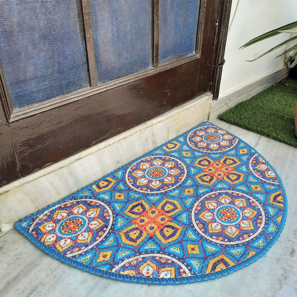 Semi-circular rug with intricate geometric print in warm vibrant shades.