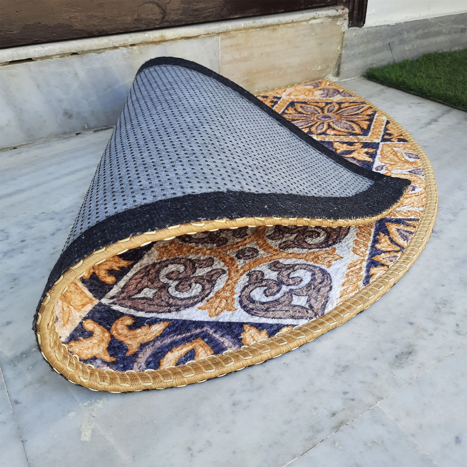 Elegant half-round floor mat enhancing the home's entrance.