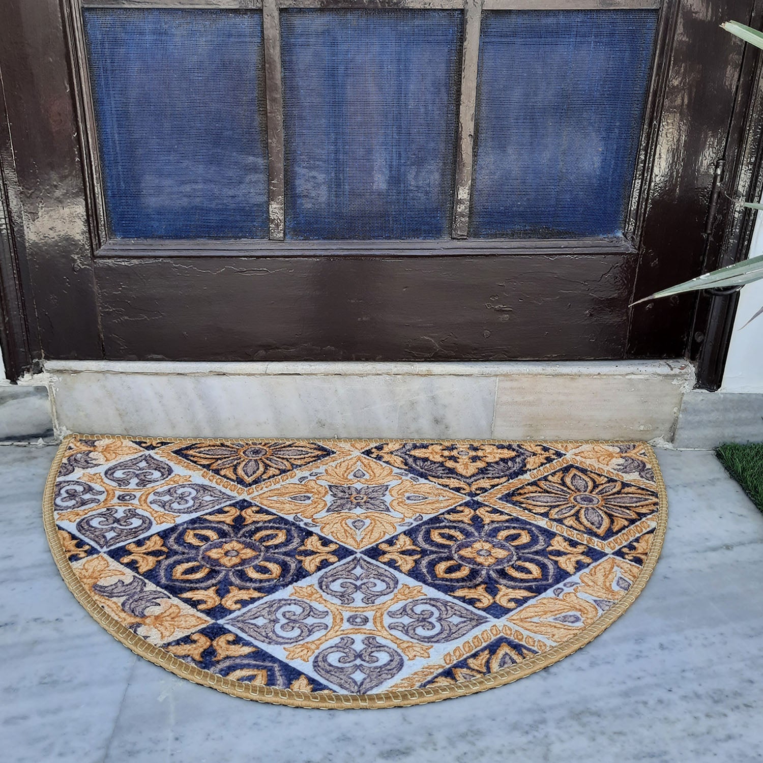 Half-circle indoor floor mat featuring detailed geometric artwork.