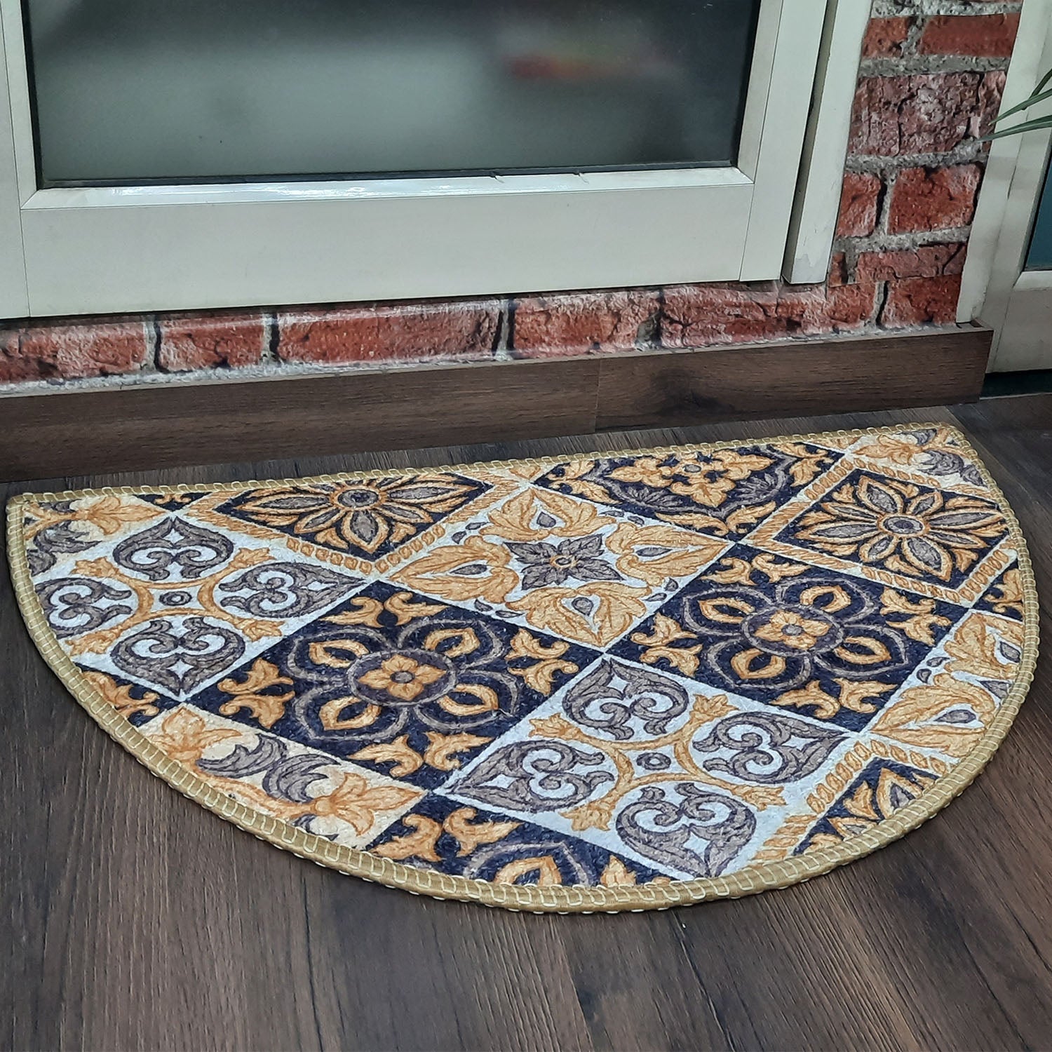 Colorful boho geometric door mat on a polished marble floor.