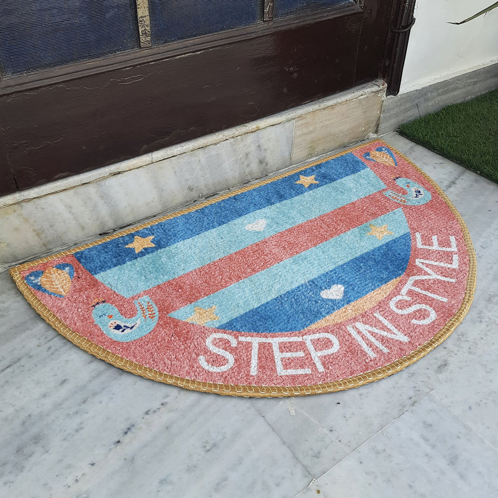 Bright geometric semi-round door mat adding color to a welcoming doorway.