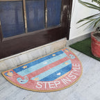 Half-moon entrance mat with intricate geometric patterns on a polished marble floor.