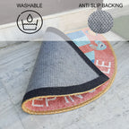 Decorative semi-circle welcome mat placed in front of a natural wooden door.