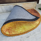 Vibrant mandala-inspired semi-circular door mat for indoor entryways.