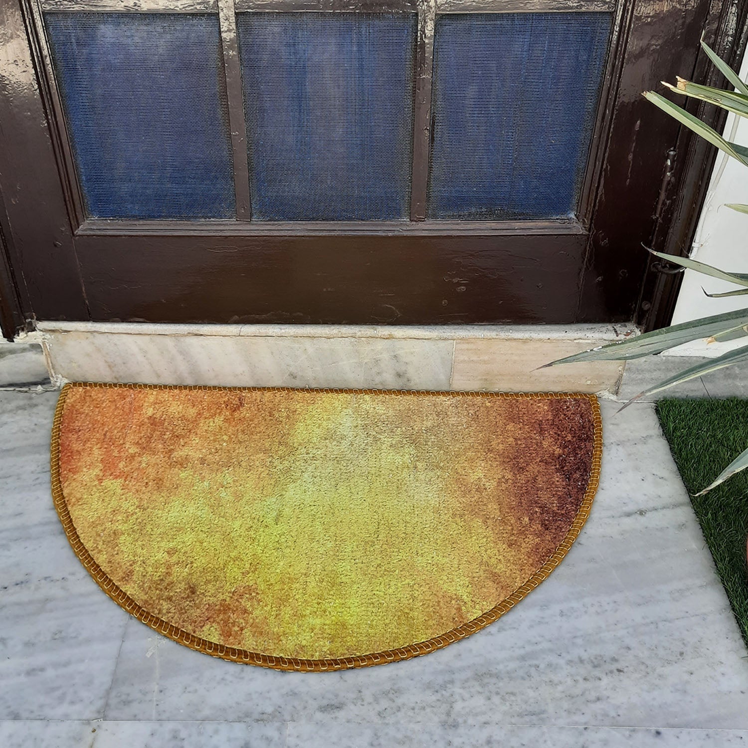 Decorative geometric half-circle mat creating an inviting front door entrance.