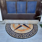 Decorative half-round rug with colorful geometric details for home entrances.