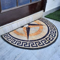 Elegant half-circle entry mat with vibrant geometric print on marble flooring.
