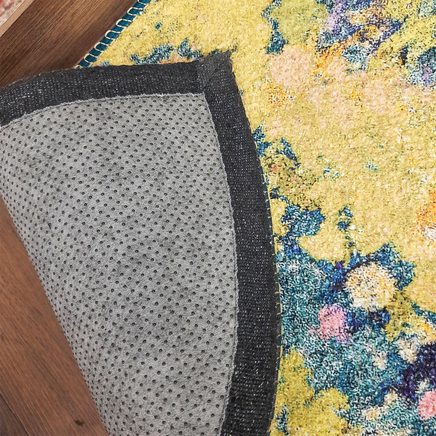 Brightly colored half-circle welcome mat for indoor entrances.