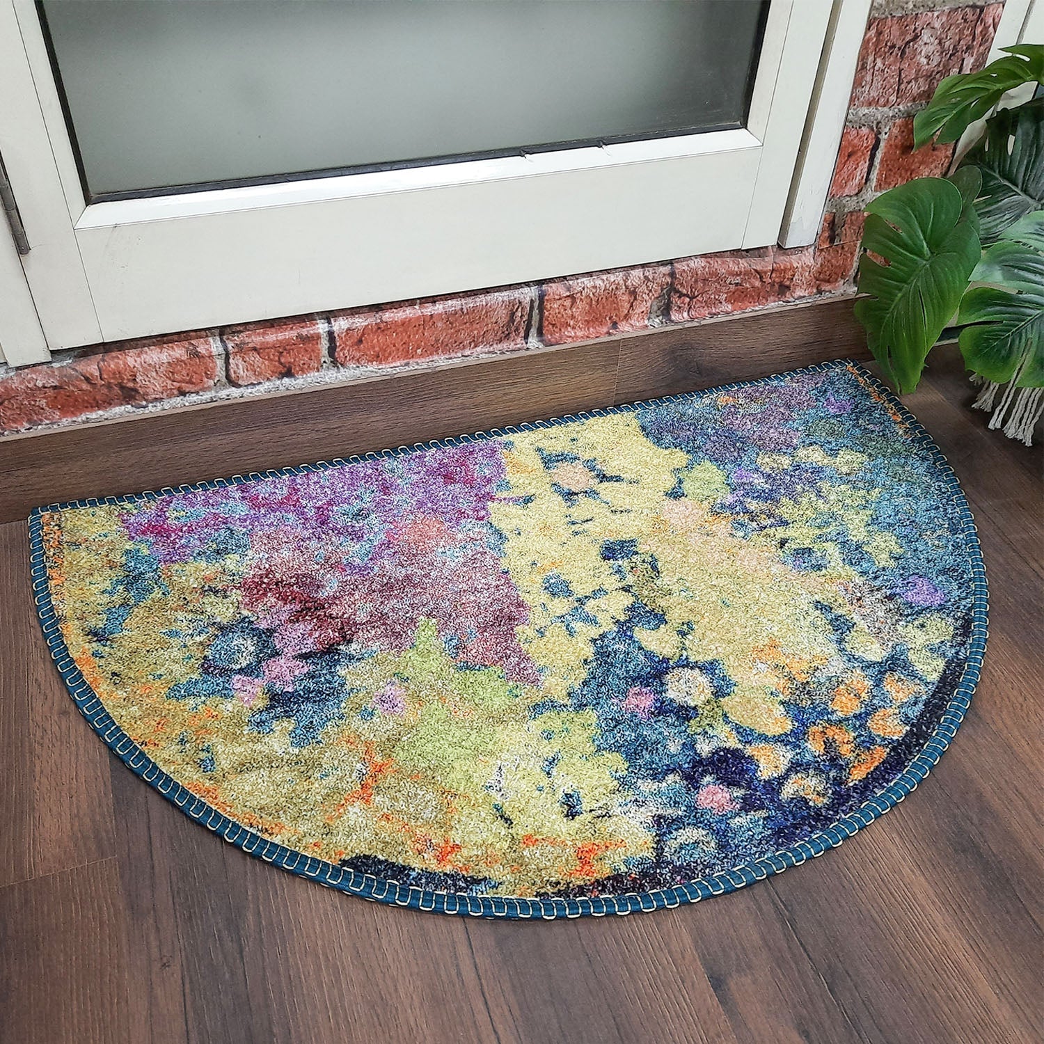 Decorative geometric entry rug placed neatly in front of a wooden door.