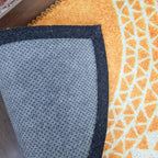 Artistic geometric semi-round rug welcoming guests in style.