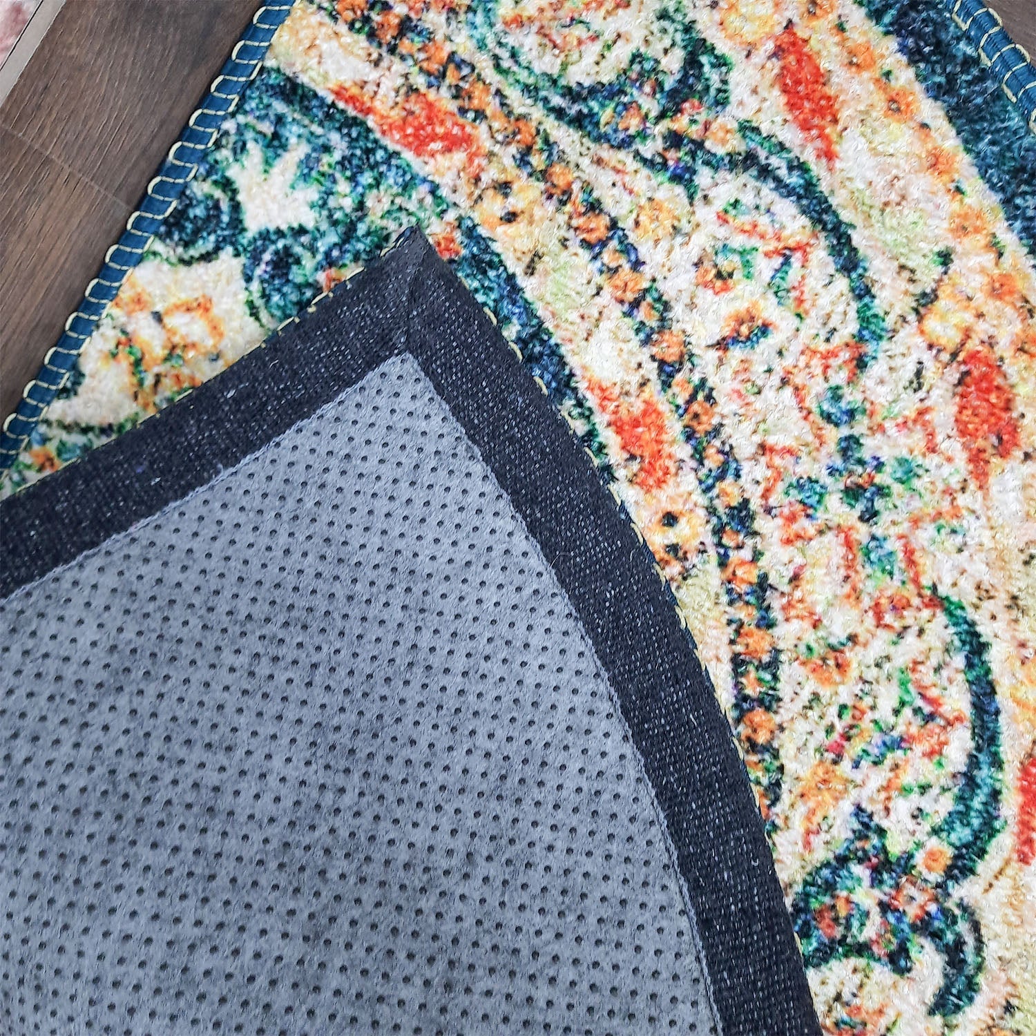 Artistic half-round floor mat featuring traditional-inspired patterns.