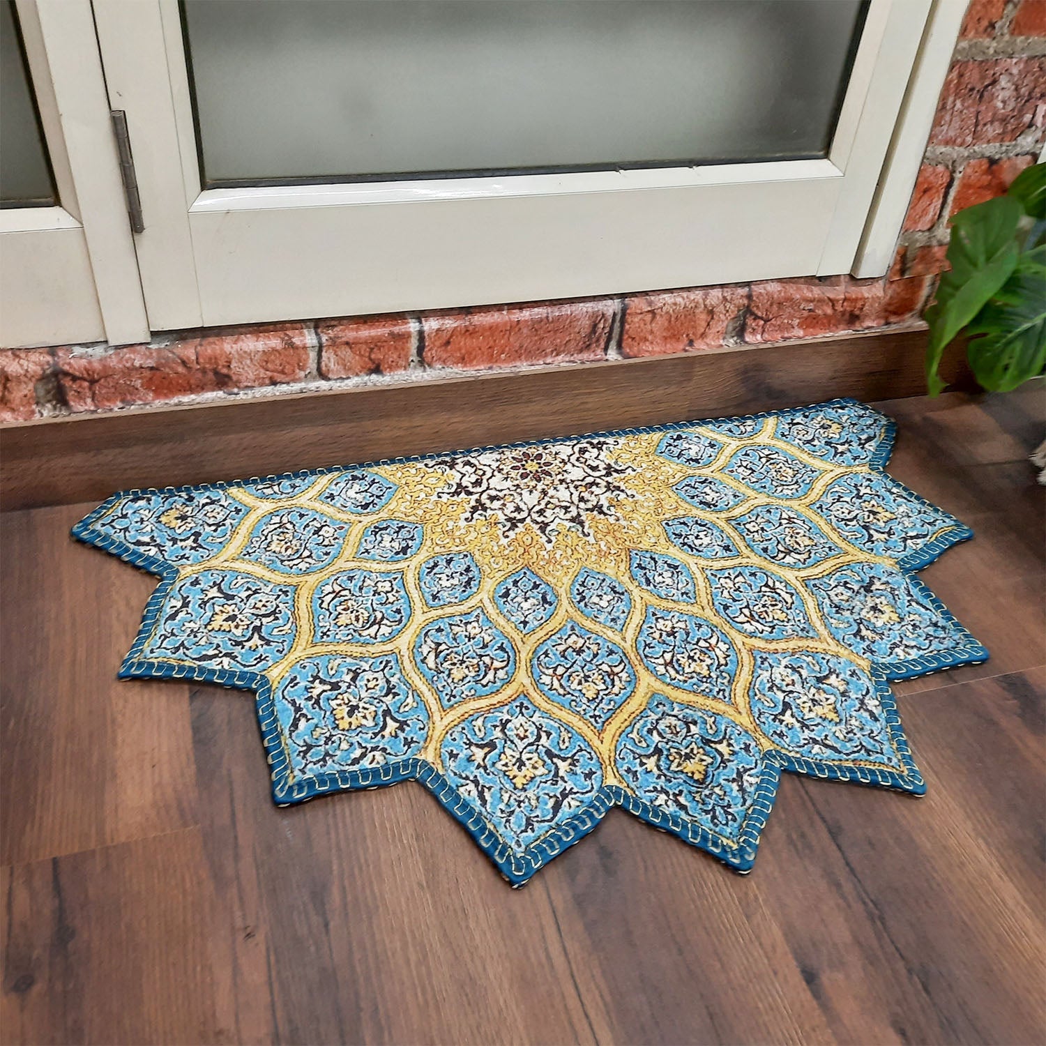 Geometric patterned semi-circle rug placed at a welcoming doorway.