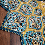 Decorative entrance floor mat with colorful mandala-inspired artwork.