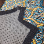 Bright semi-circular geometric mat creating an inviting entryway.