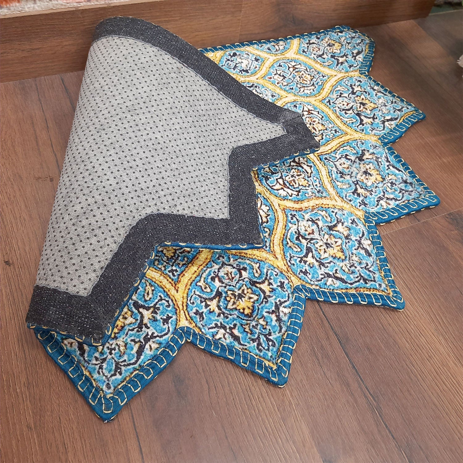 Colorful half-round doormat adding visual appeal to any entrance.