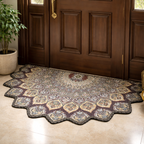 Decorative door mat with intricate Persian pattern in front of a wooden door.